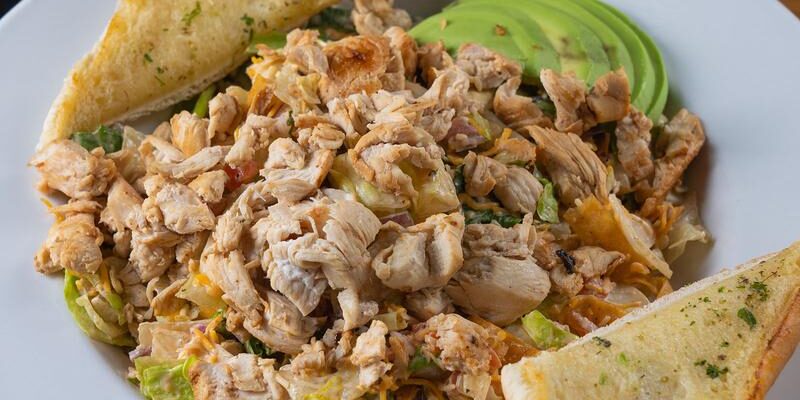 chicken salad with avocado and garlic bread