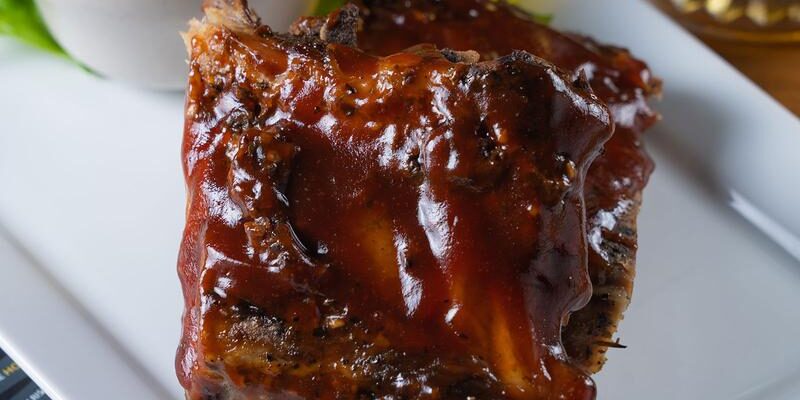BBQ sauce on ribs with coleslaw